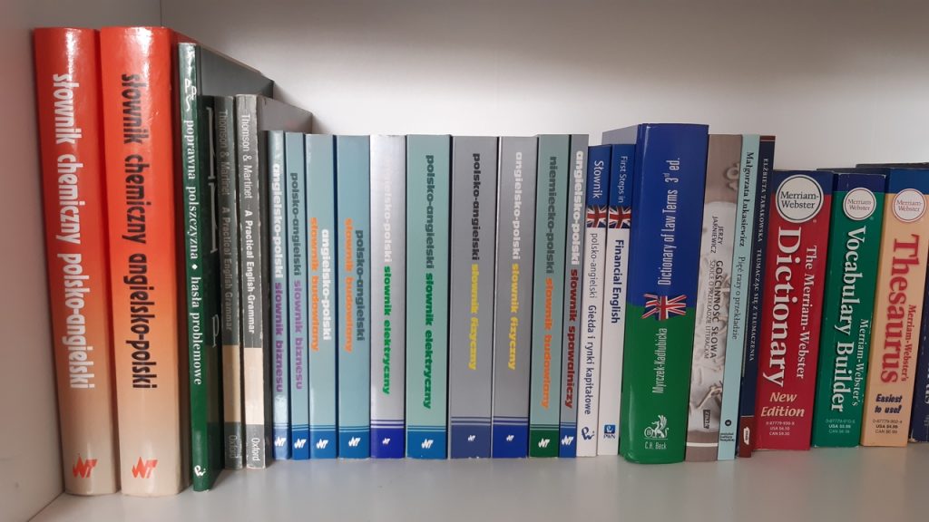 a bookshelf full of dictionaries for translators